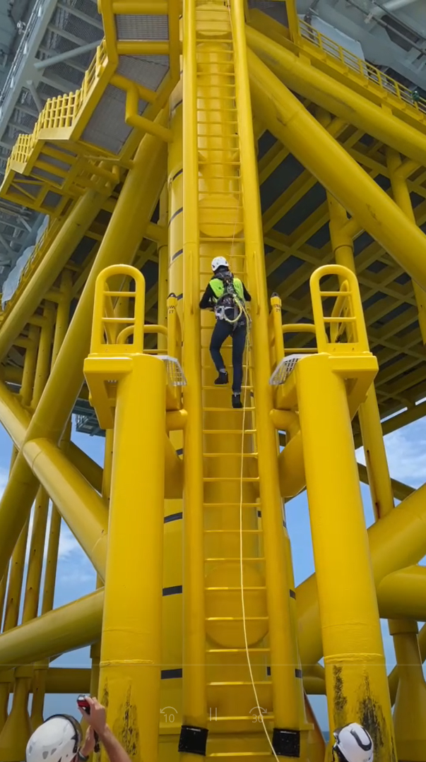 Labor Inspector Climbs Up A Vertical Ladder 20 Meters In Height At The Offshore Sub Station Of The Offshore Wind Farm